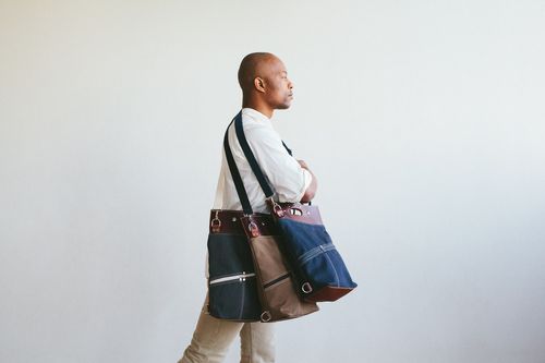 a waxed canvas and leather triple duty convertible bag